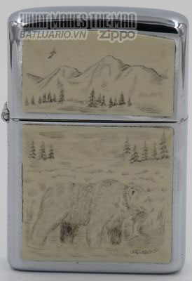 Zippo 1980 with grizzly bear scrimshawed by Lois McLane